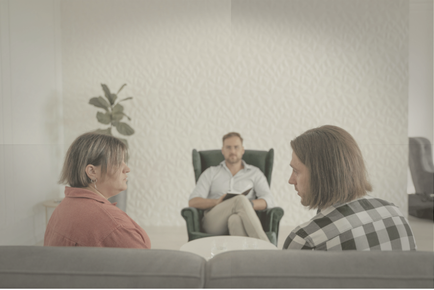 Couple discussing divorce mediation with a neutral third party